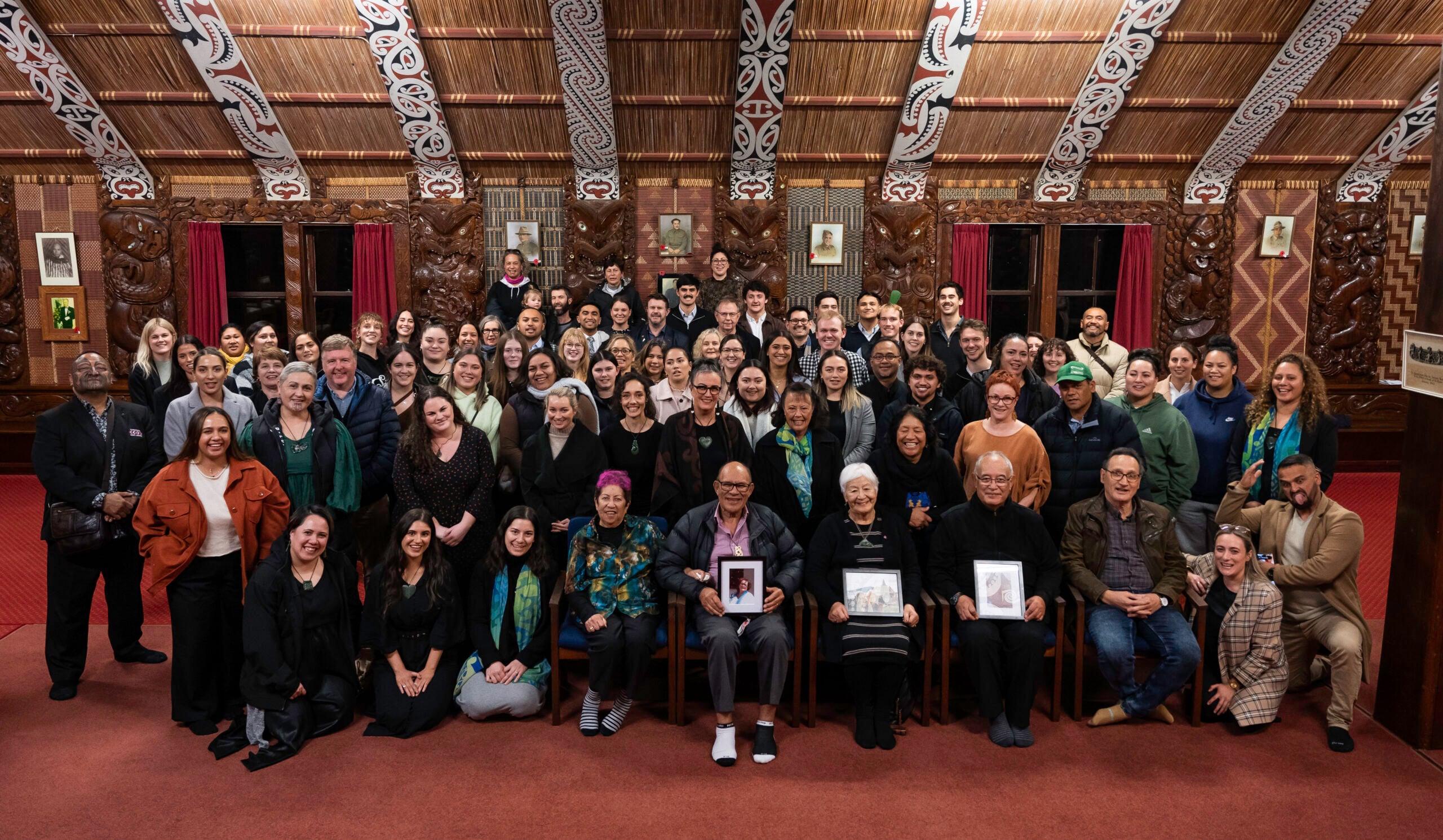 Te Ao Mārama group gathered inside a wharenui